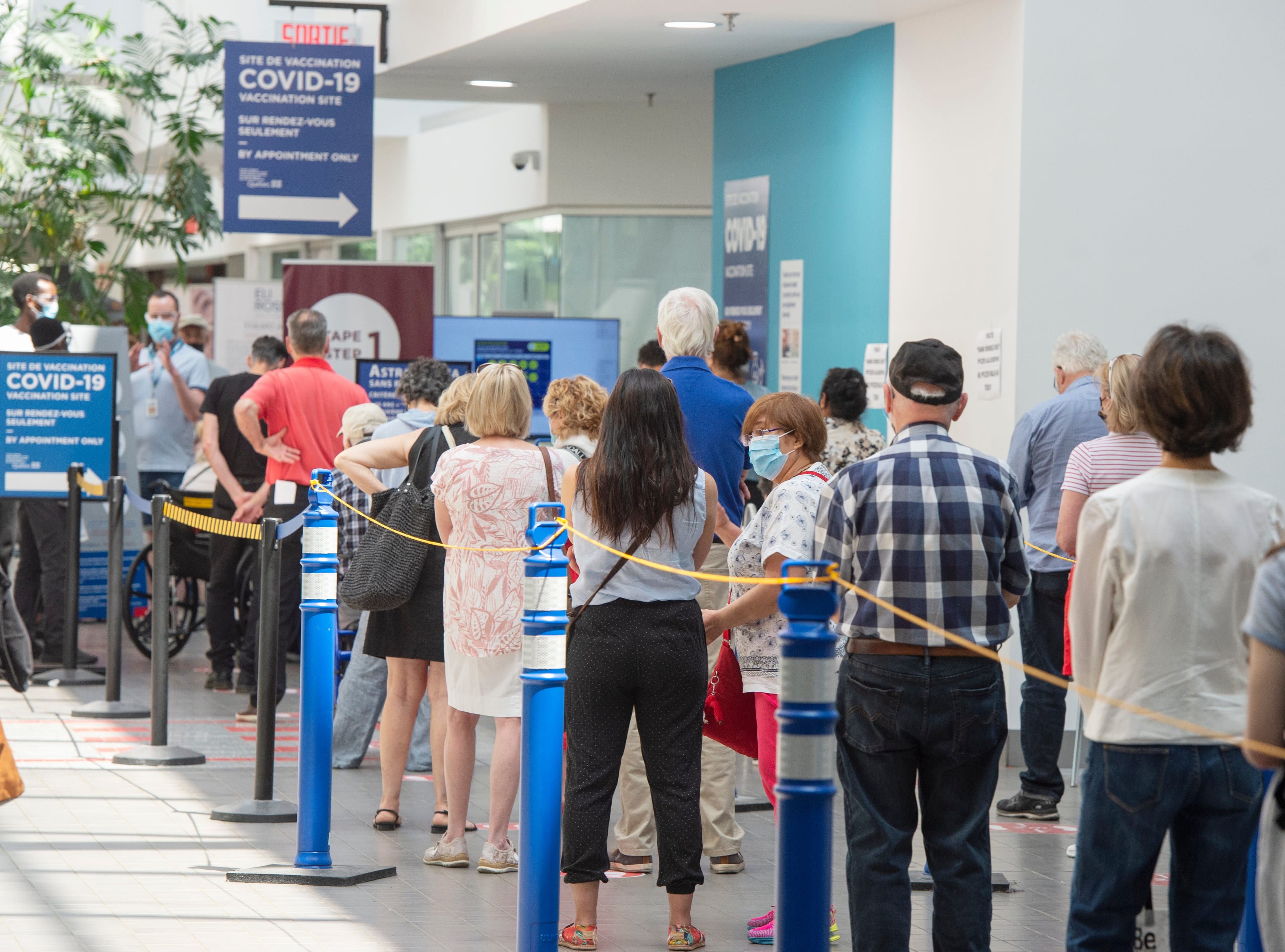People line up to get their COVID-19 vaccines in Montreal (Ryan Remiorz/CP)