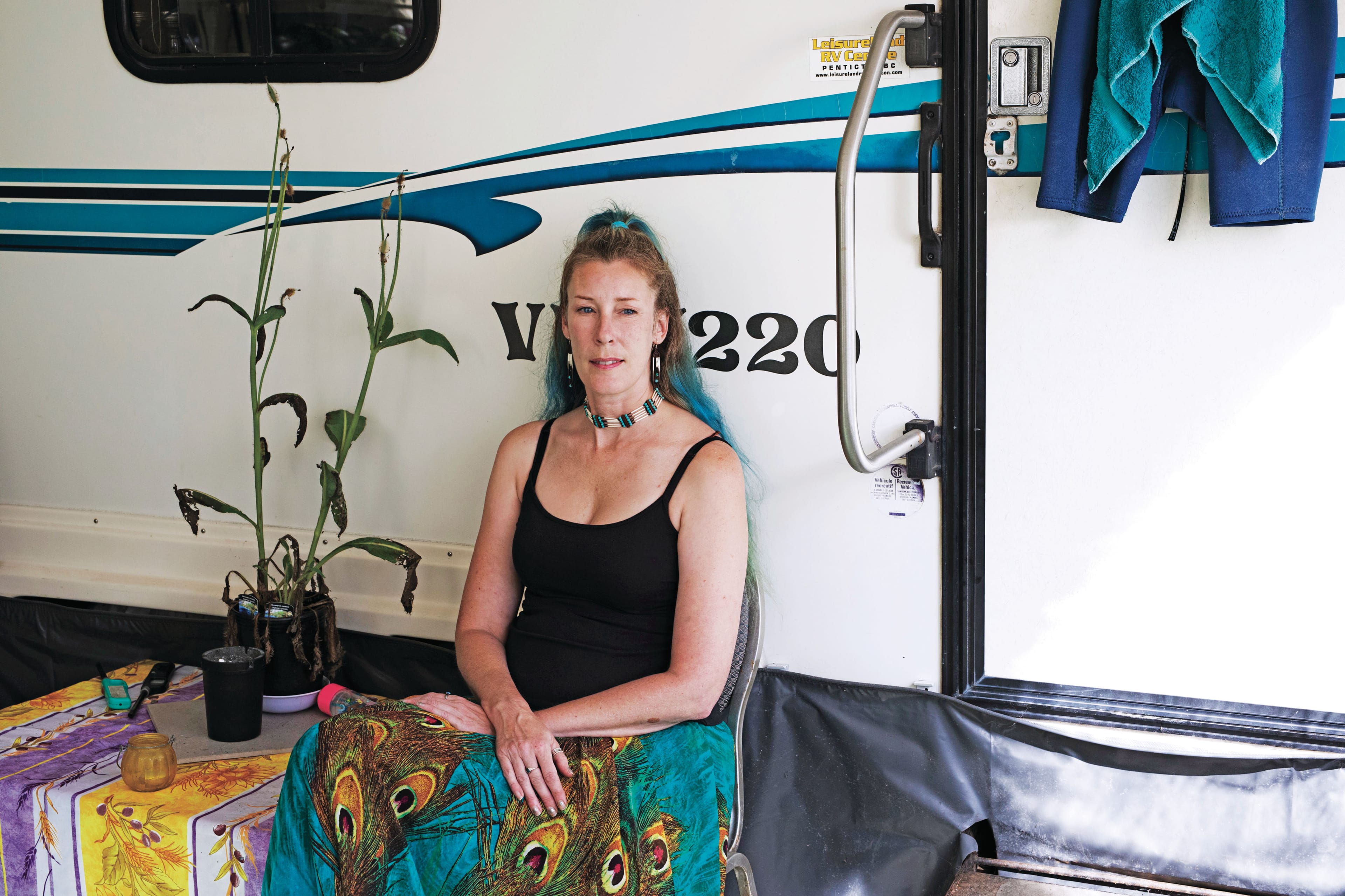 Tina Halcorn poses outside of her home at the Crab Apple Campground, where she has been living since Oct. 2019. (Photograph by Melissa Renwick)