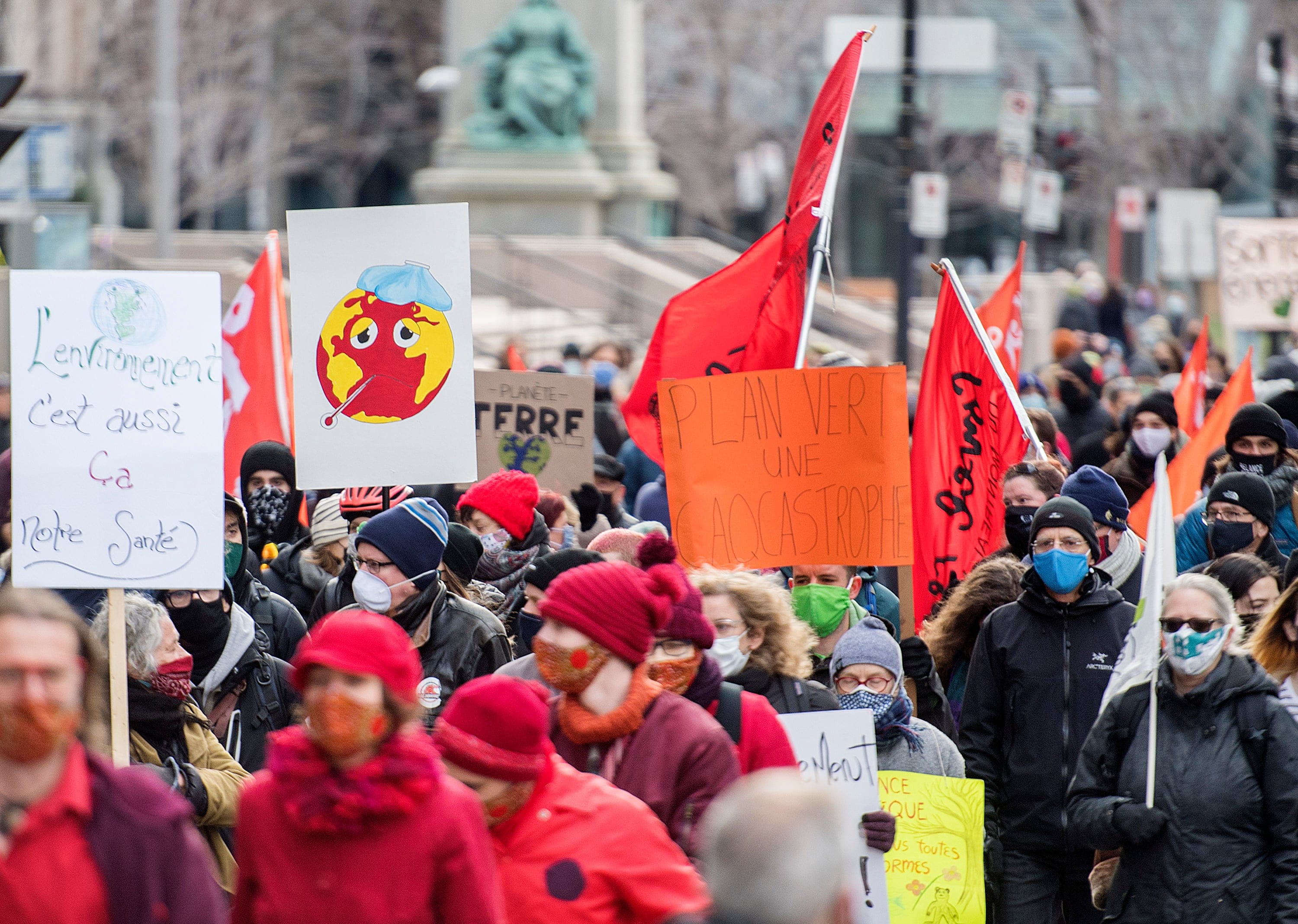 People take part in a climate change protest in Montreal on Nov. 21, 2020 (Graham Hughes/CP)