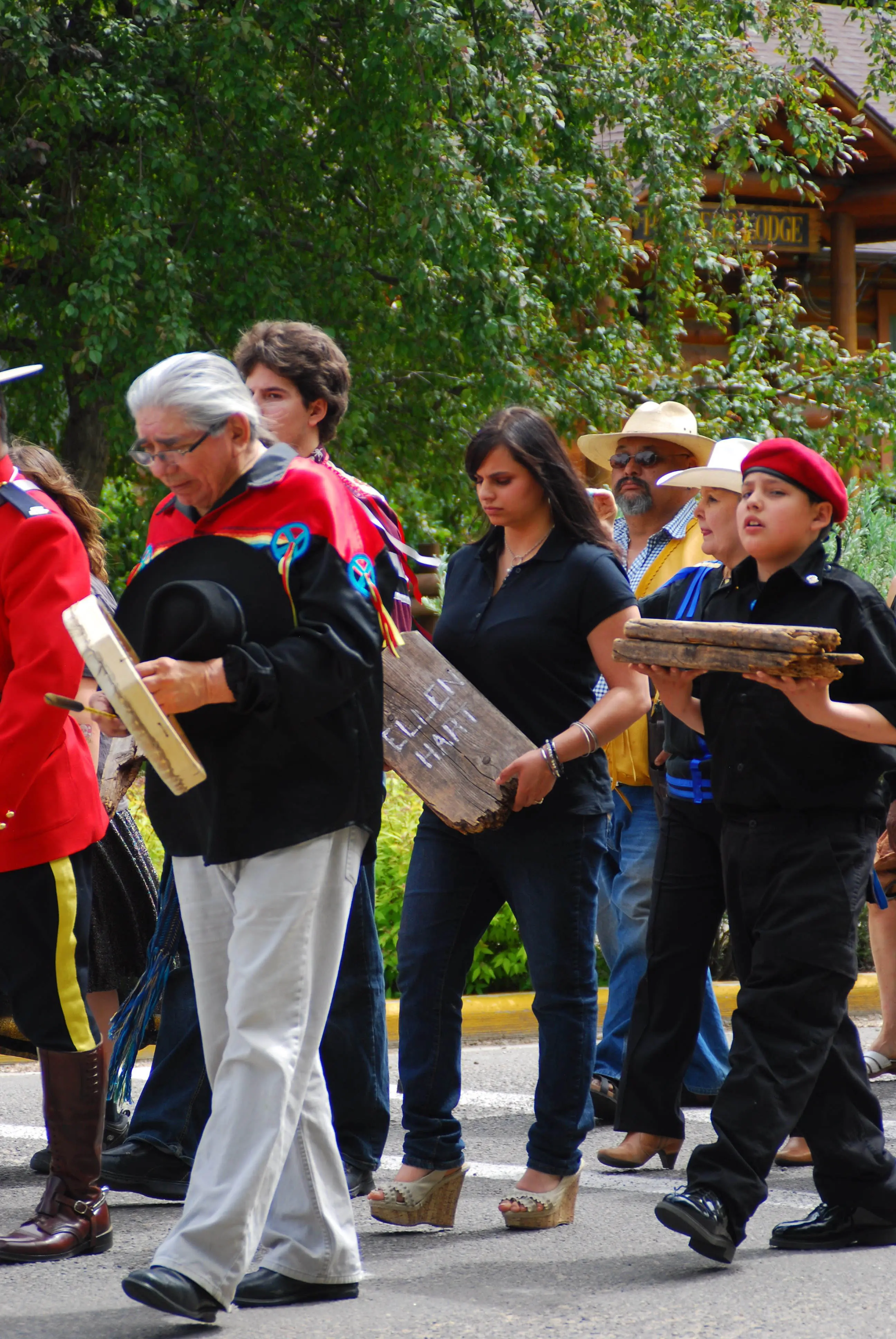 Adriana DuVal (centre) and Talon Lightning (right) carry headboards from the Red Deer Industrial School cemetery. The headboards belonged to students who had attended the school from 1893 to 1919. They will be on display at the Red Deer Musuem + Art Gallery. (Red Deer Express)