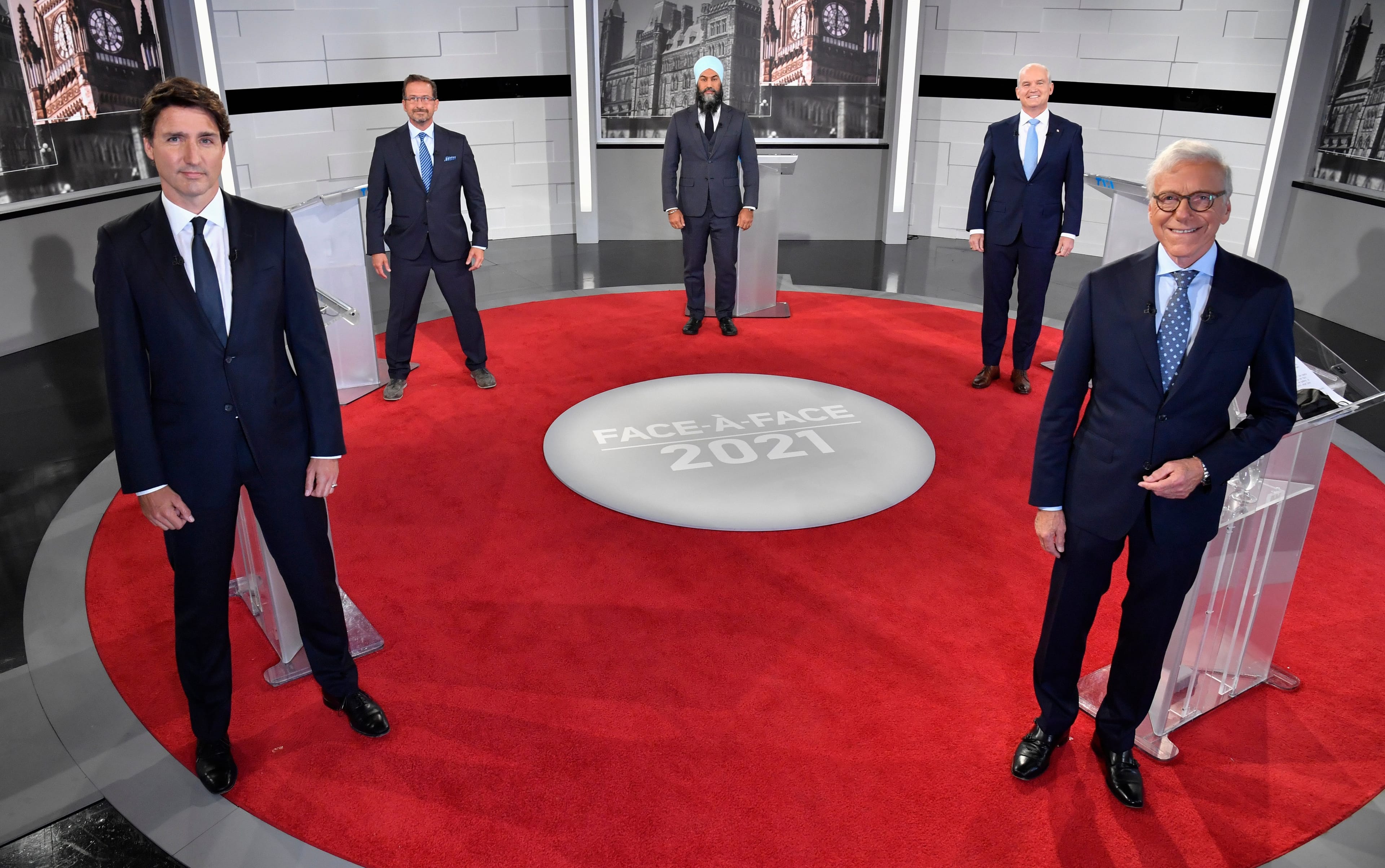 Liberal Leader Justin Trudeau, left to right, Bloc Quebecois Leader Yves-Francois Blanchet, NDP Leader Jagmeet Singh, Conservative Leader Erin O'Toole and debate moderator Pierre Bruneau pose for a photo during the first French leaders' debate on Thursday, September 2, 2021 in Montreal. THE CANADIAN PRESS/Martin Chevalier - POOL