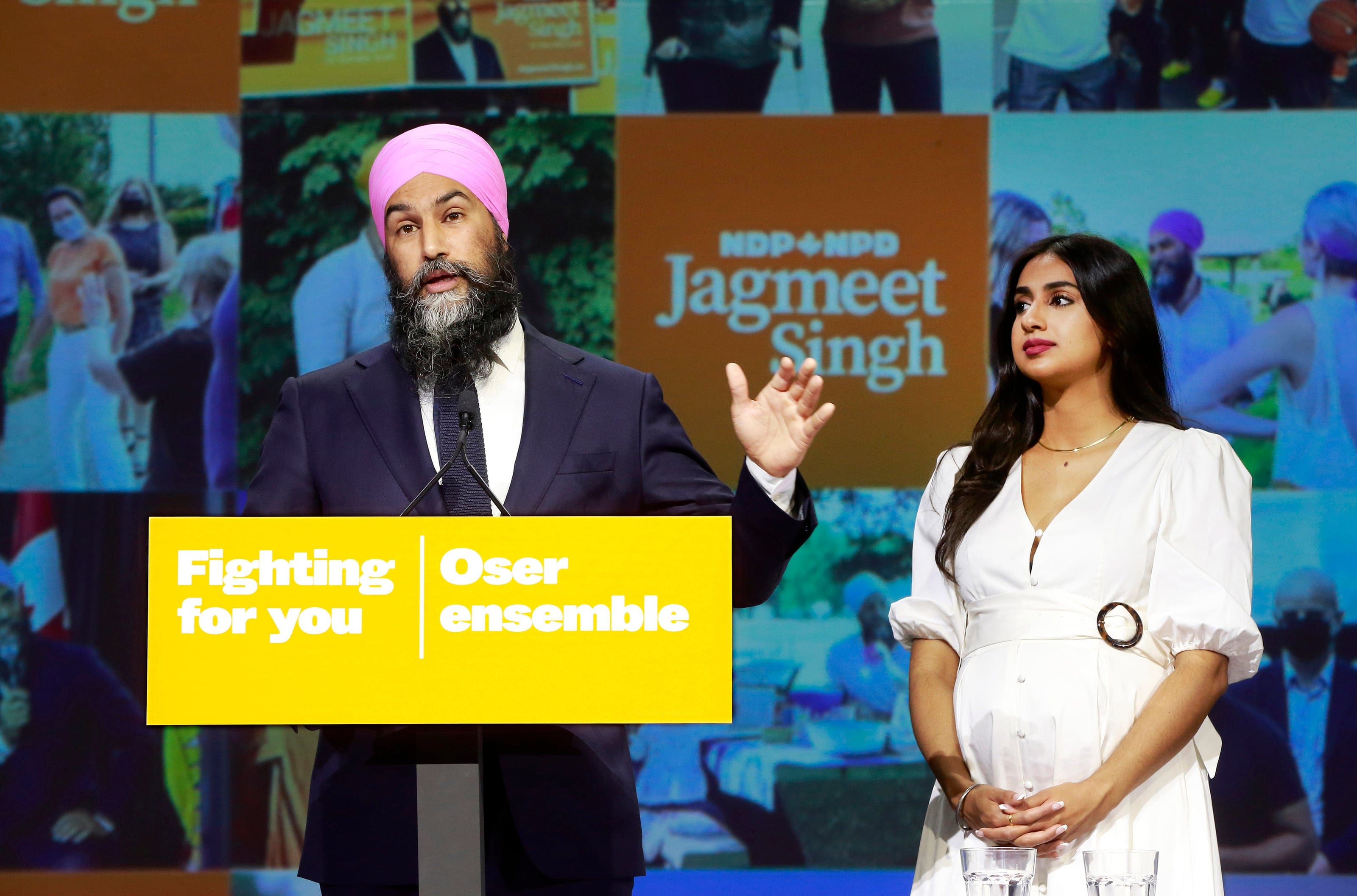 NDP Leader Jagmeet Singh stands with his wife Gurkiran Kaur Sidhu as he delivers remarks at an election night event on September 20, 2021 in Vancouver, Canada. For the first time in a decade, the New Democratic Party will have more seats in parliament than they had at the start of the election, picking up an additional three seats for a projected total of 27. (Jeff Vinnick/Getty Images)