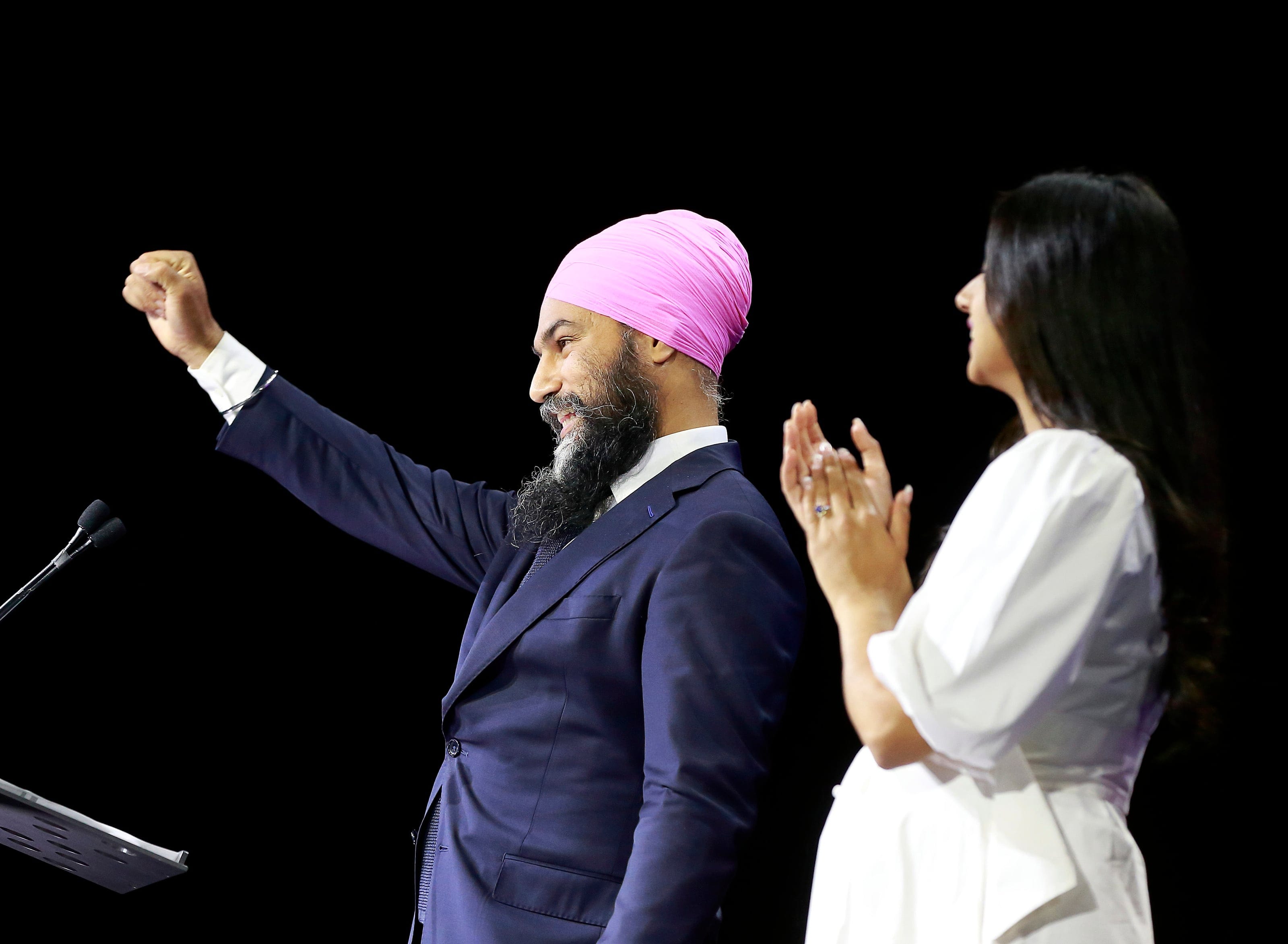 New Democratic Party Leader Jagmeet Singh stands with his wife, Gurkiran Kaur Sidhu, as he delivers remarks at an election night event on September 20, 2021 in Vancouver, Canada. (Jeff Vinnick/Getty Images)