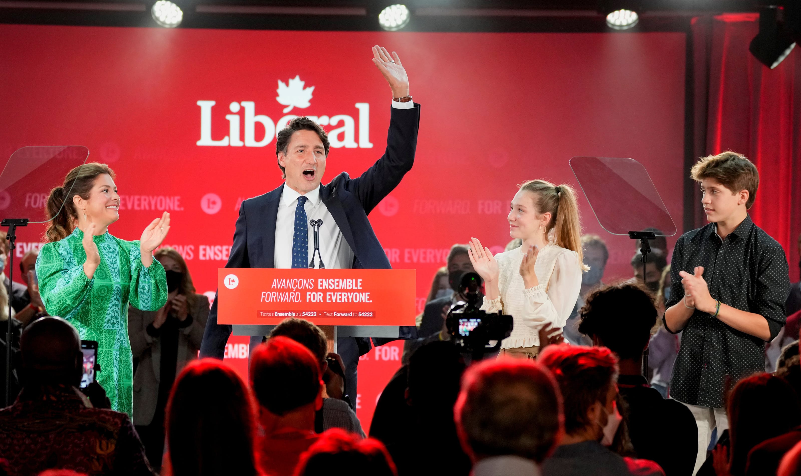 Canada's Liberal Prime Minister Justin Trudeau, accompanied by his wife Sophie Gregoire and their children Ella-Grace and Xavier, waves to supporters during the Liberal election night party in Montreal, Quebec, Canada, September 21, 2021. (Carlos Osorio/Reuters)