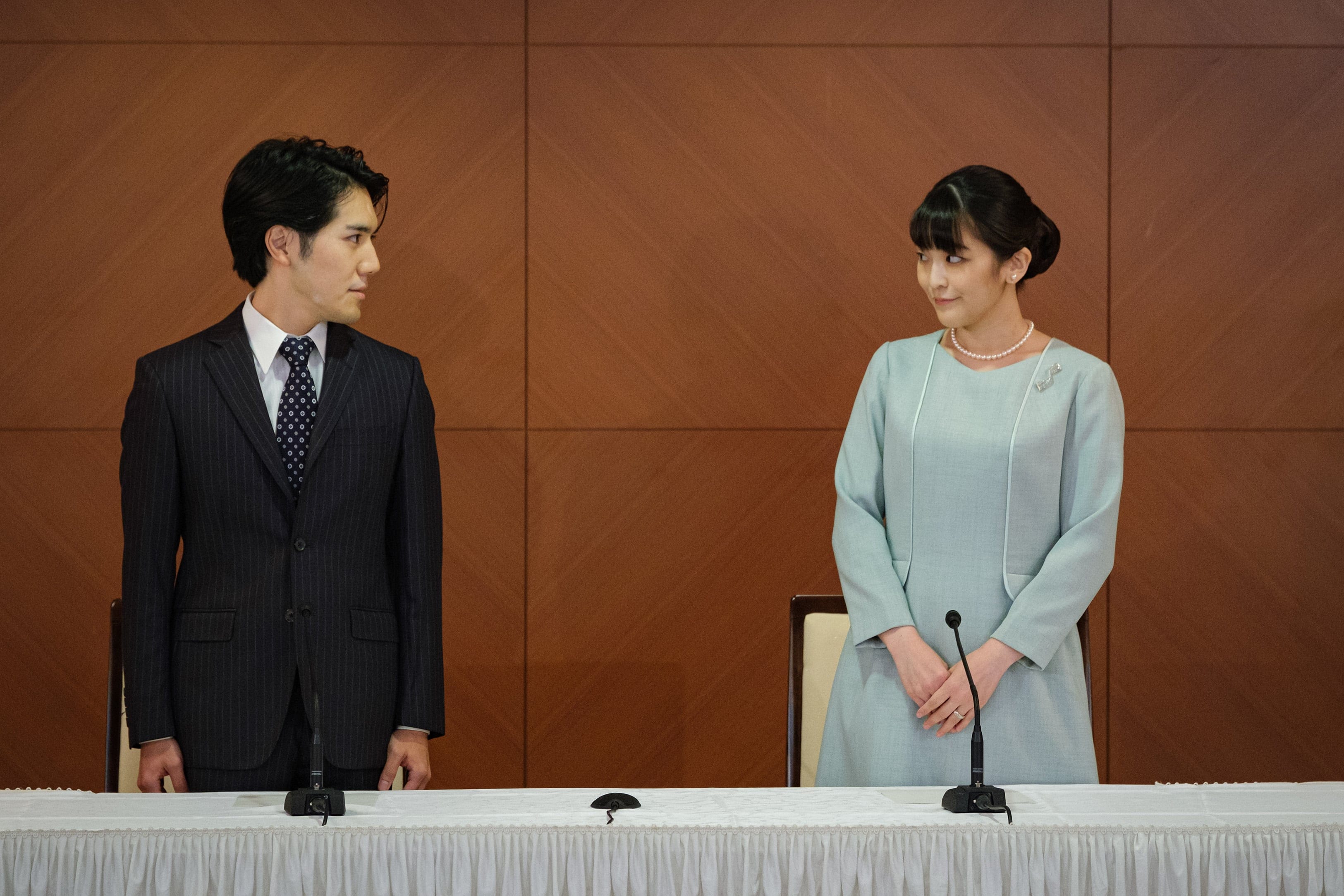 Princess Mako, the elder daughter of Prince Akishino and Princess Kiko, and her husband Kei Komuro, a university friend of Princess Mako, poses during a press conference to announce their marriage registration at Grand Arc Hotel in Tokyo, Japan on October 26, 2021. (Nicolas Datiche/Anadolu Agency/Getty Images)