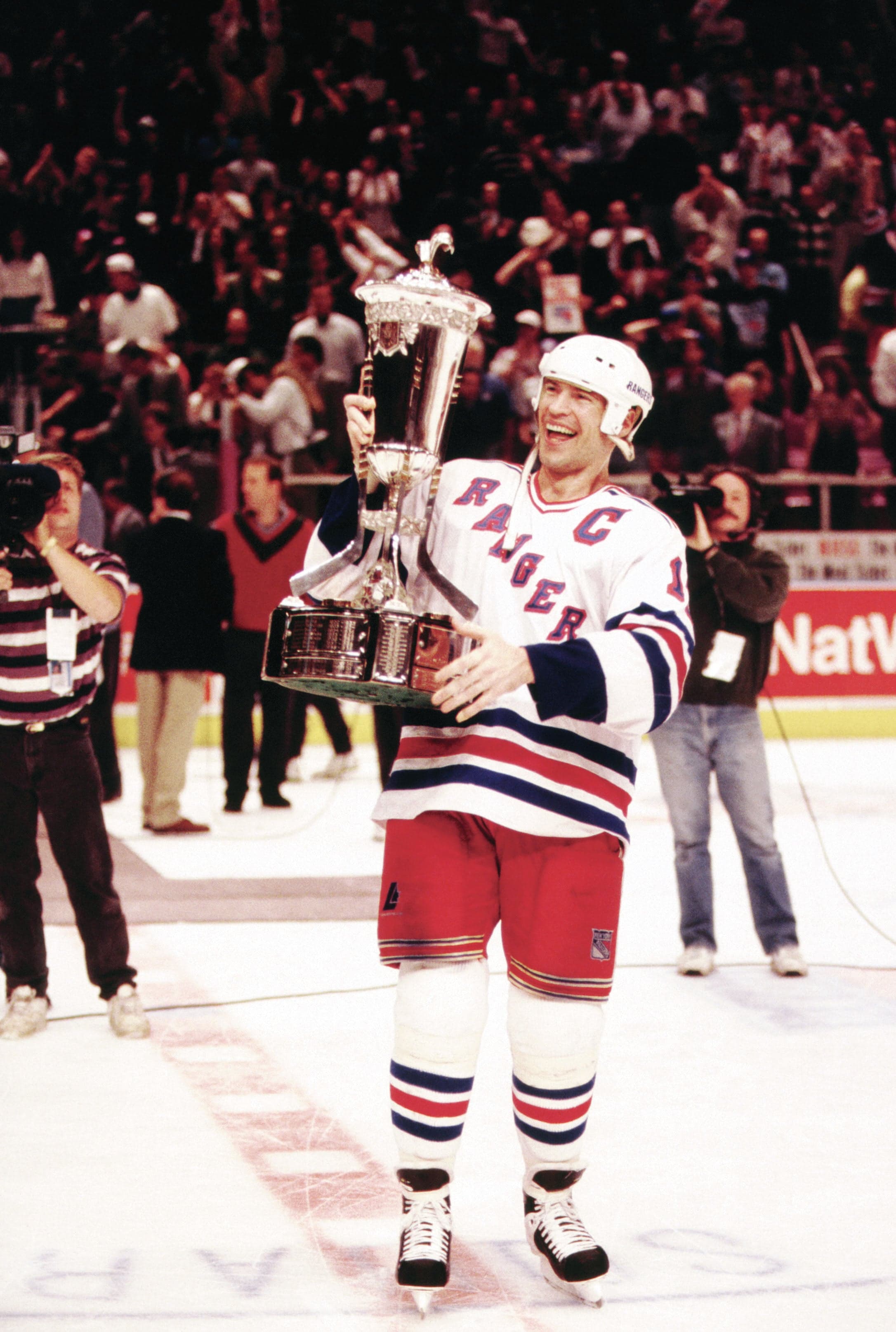 Mark Messier #11 of the New York Rangers holds the Prince of Wales Trophy after the Rangers defeated the New Jersey Devils in Game 7 of the Eastern Conference Finals on May 27, 1994 at the Madison Square Garden in New York, New York (B Winkler/Bruce Bennett Studios/Getty Images)
