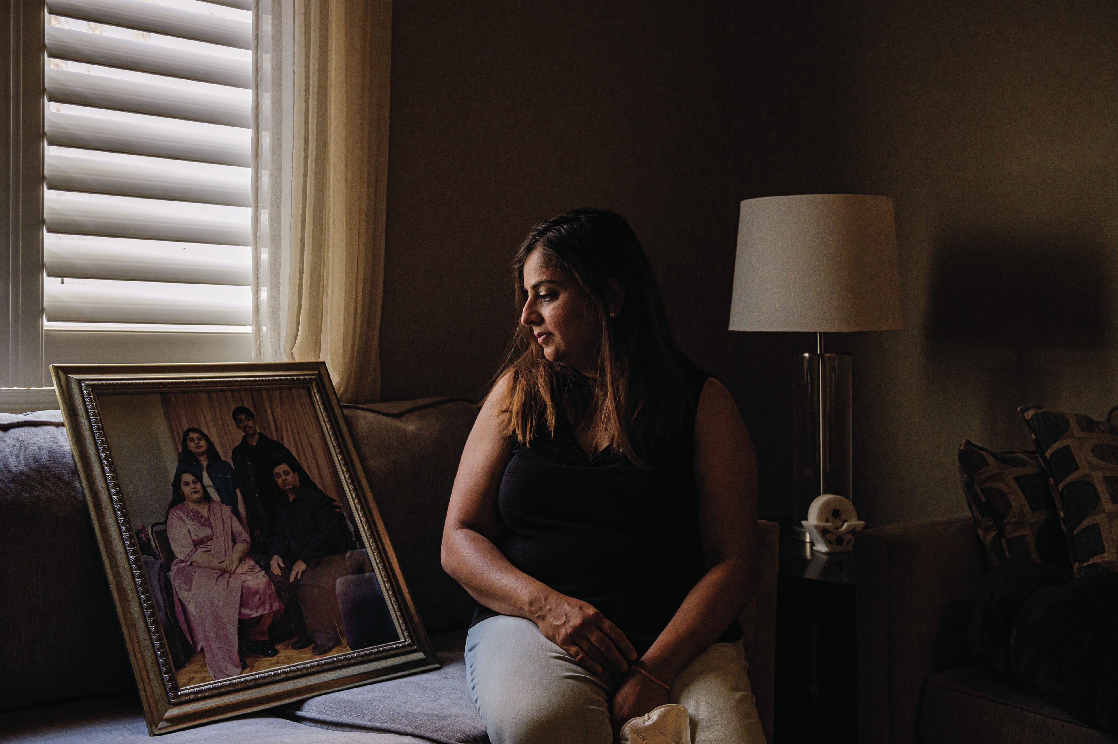 Menka in her parents’ once-bustling Brampton, Ont., home, which many called a safe and happy place. (Photograph by Christopher Katsarov Luna)
