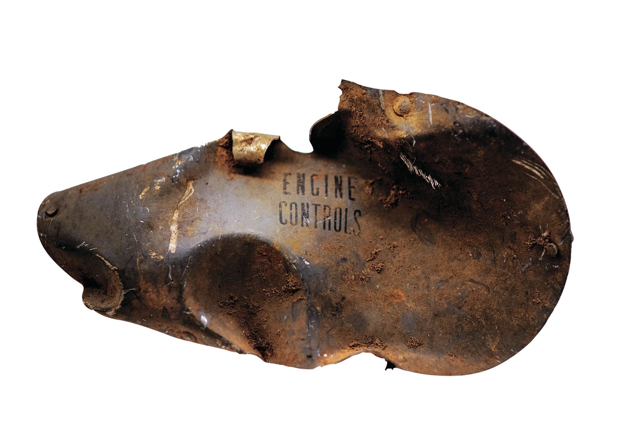 An engine control cover from William Kyle's Dakota C-47 aircraft that crashed on 21 June 1945. The condition of the items reflects their 50 years in the jungle of Burma. (Photograph by Shelby Lisk)