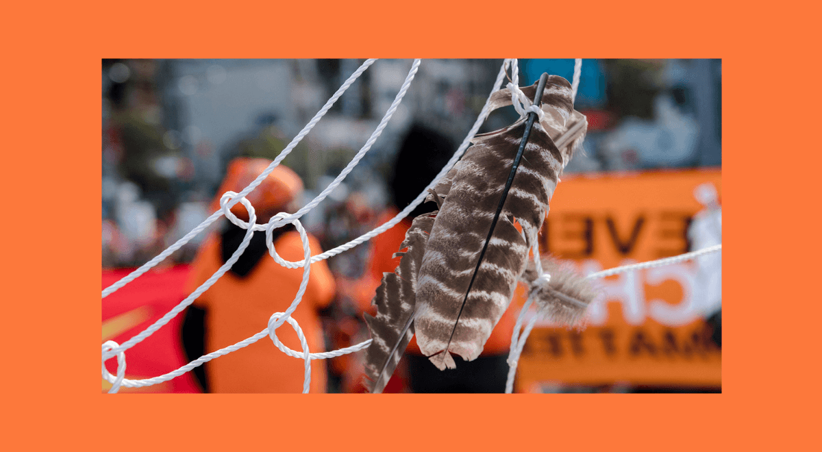 A feather is seen on a giant dreamcatcher during the "Every Child Matters" march to mark the first National Day for Truth and Reconciliation in Montreal, Canada on September 30, 2021. - The mobilization is part of the "Every Child Matters" movement to commemorate the victims of Residential Schools, the last of which closed in 1996 in Canada. Earlier this week, Catholic bishops apologized for the trauma, past and ongoing, and actions done towards indigenous people in Residential Schools. (Photo by Andrej Ivanov / AFP) (Photo by ANDREJ IVANOV/AFP via Getty Images)