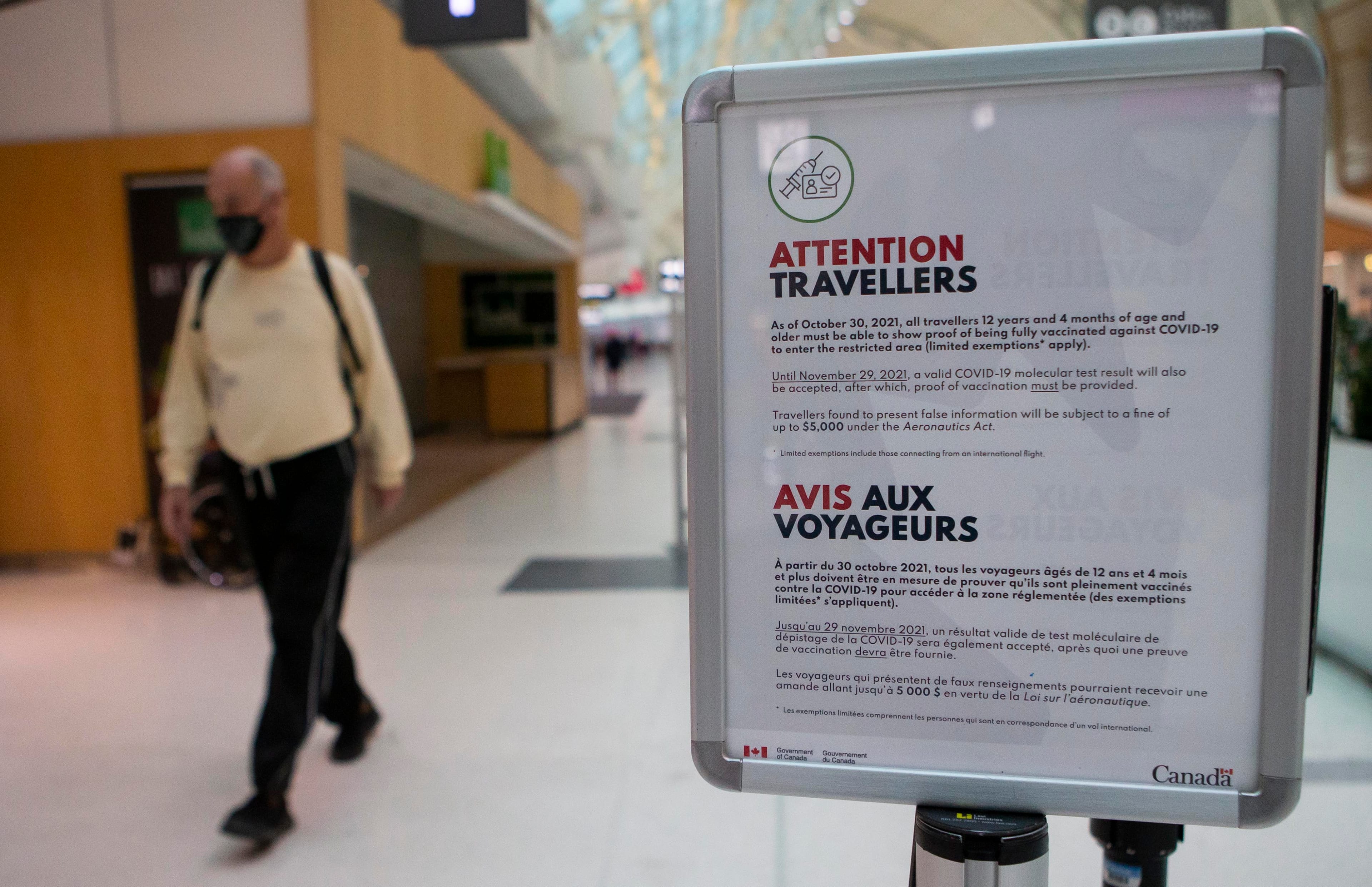 MISSISSAUGA (CANADA), Oct. 30, 2021 A mandatory vaccination sign for travelers is seen at Toronto Pearson International Airport in Mississauga, Ontario, Canada, on Oct. 30, 2021. Beginning Saturday, travelers who are 12 years of age or older need to provide proof that they have been fully vaccinated against COVID-19 while taking their trips within Canada or overseas. (Credit Image: © Zou Zheng/Xinhua via ZUMA Press)