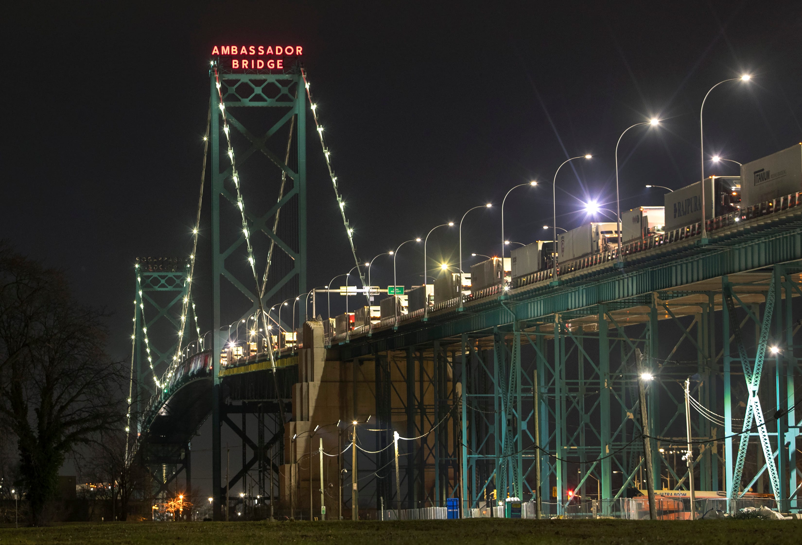 Trucks are lined up on the Ambassador Bridge between Windsor and Detroit, Michigan, Dec. 18, 2021. (Fred Thornhill/The Canadian Press)