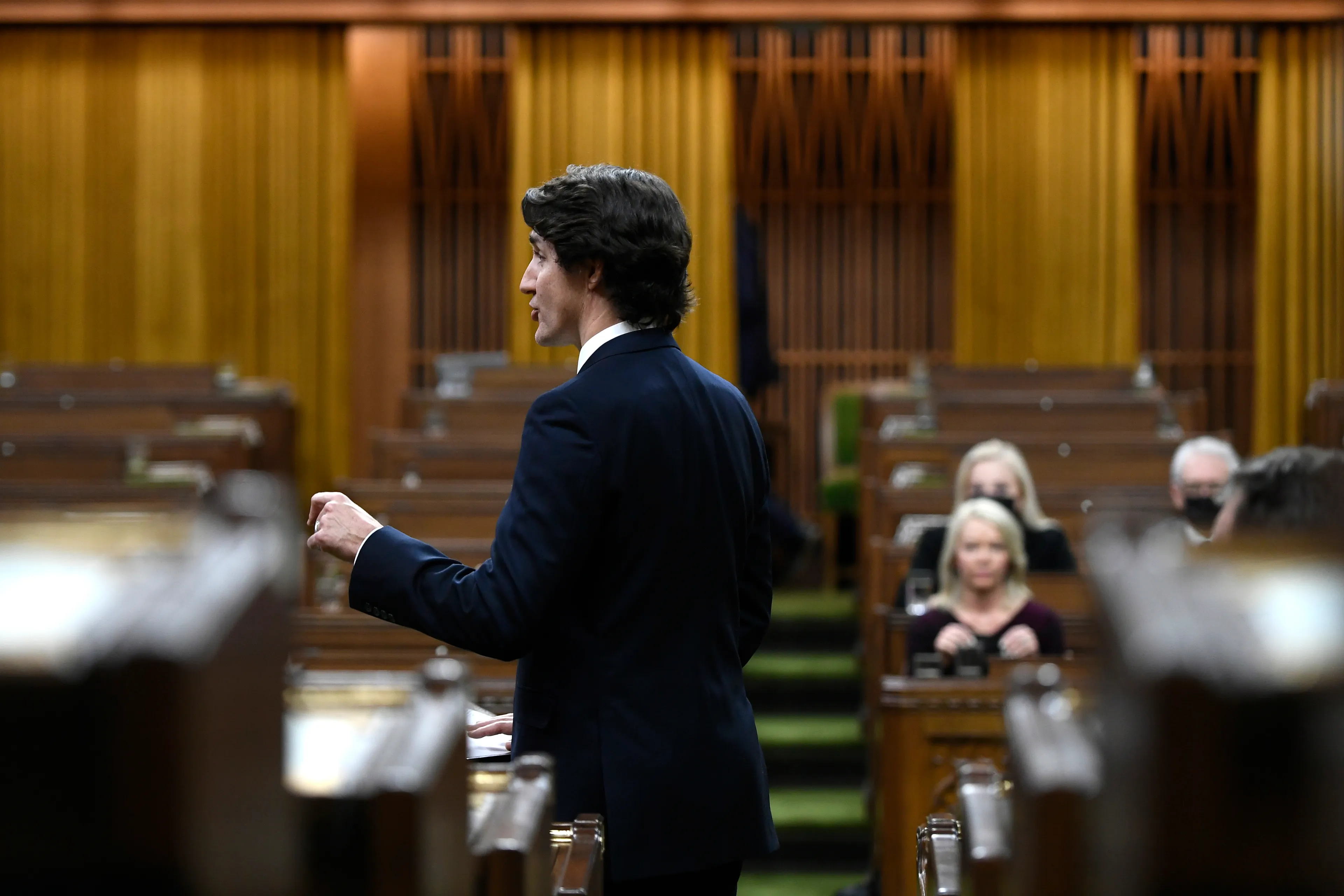 Trudeau rises during an emergency debate in the House of Commons on the situation in Ottawa, Feb. 7, 2022. (Justin Tang/The Canadian Press)