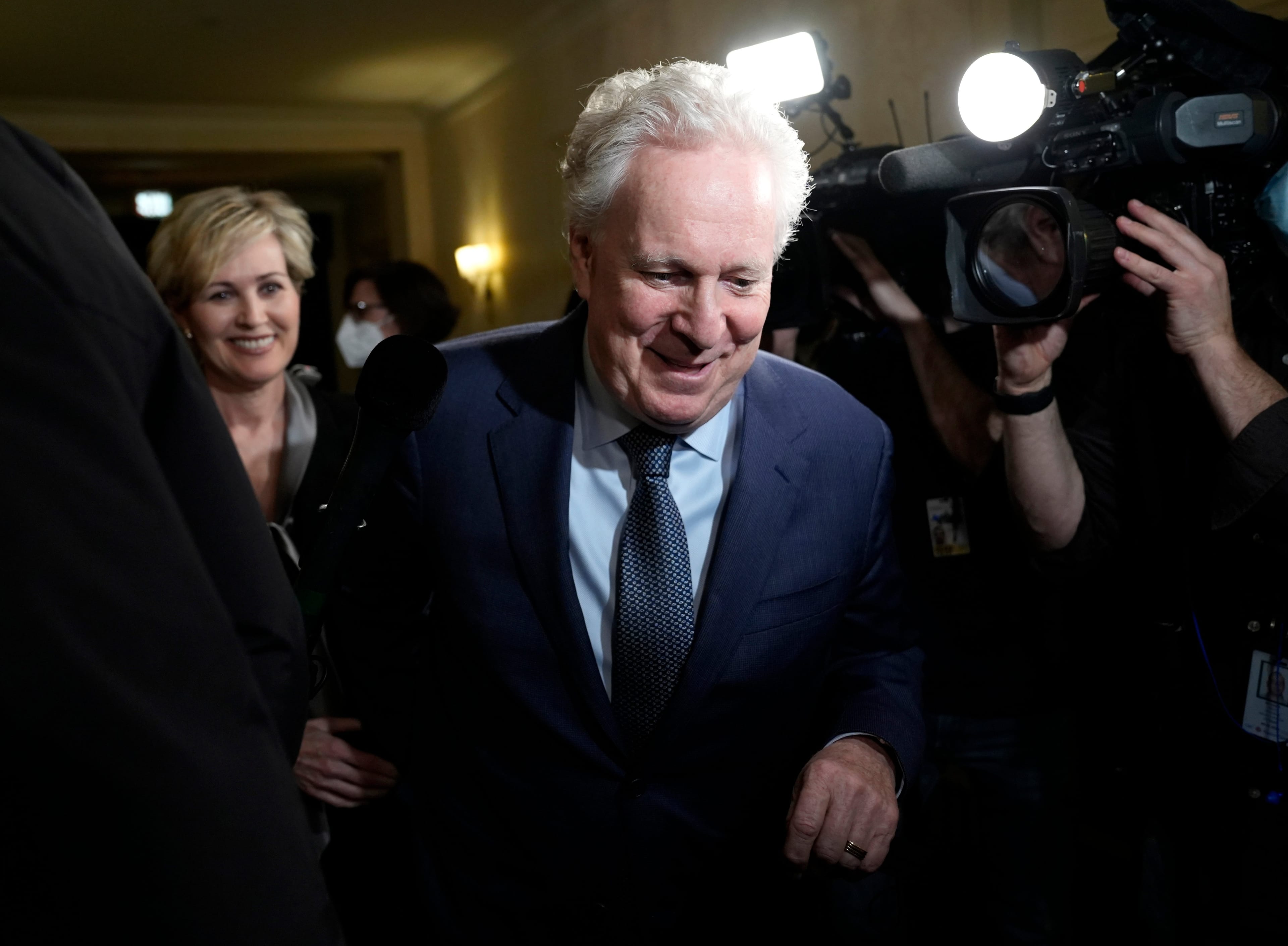 Charest arrives with his wife Michele Dionne for an event with potential caucus supporters in Ottawa, on March 2, 2022 (Justin Tang/CP)