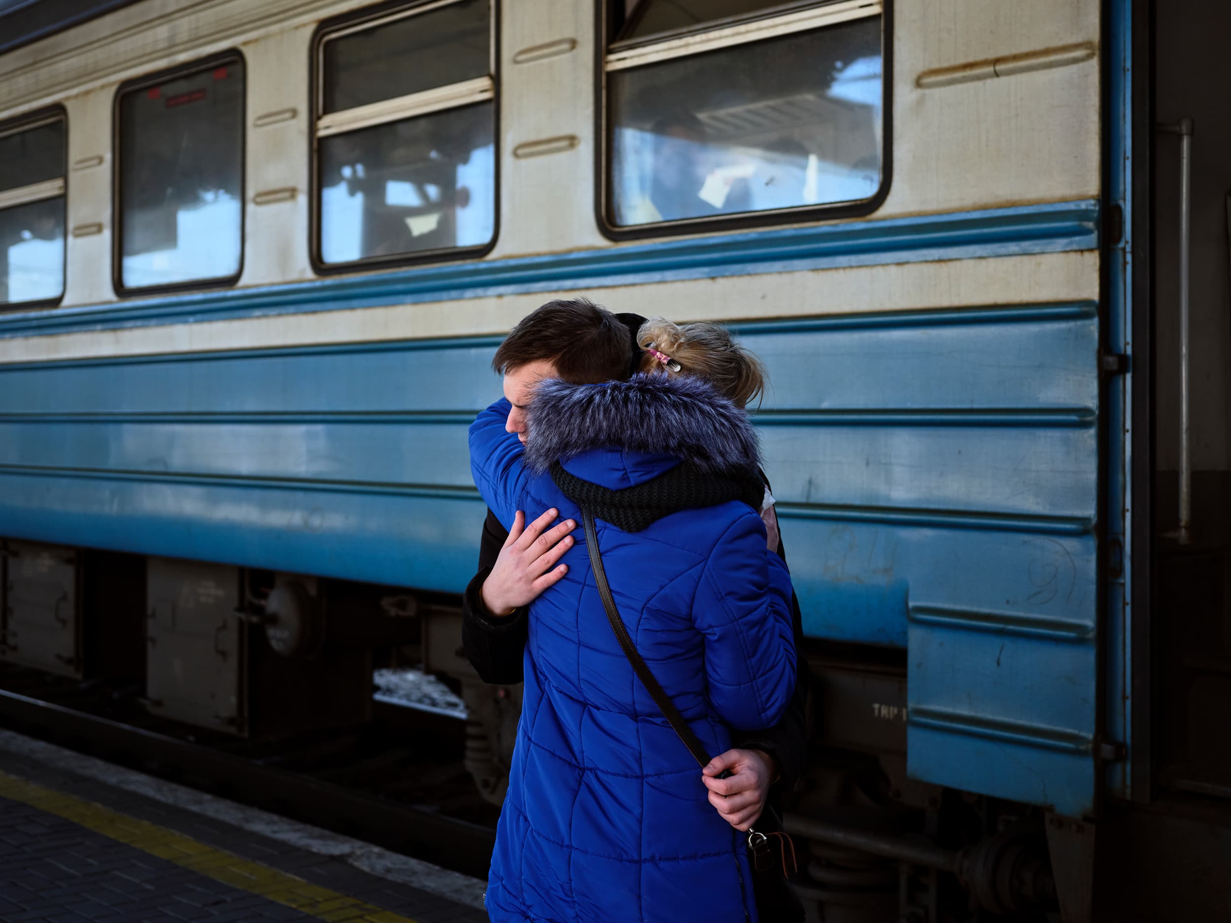Kyiv-Pasazhyrski Railway Station, March 10. “This man was boarding an evacuation train headed for Lviv. He appeared to be of military age, so I assumed he was going to join the police or the Territorial Defence Forces. I found it odd that his mother was staying in Kyiv. They were the only two people left on the platform after everyone else had boarded. After this shot, he climbed onto the train and cried and waved to her until the doors closed.” (Photograph by Philip Cheung)