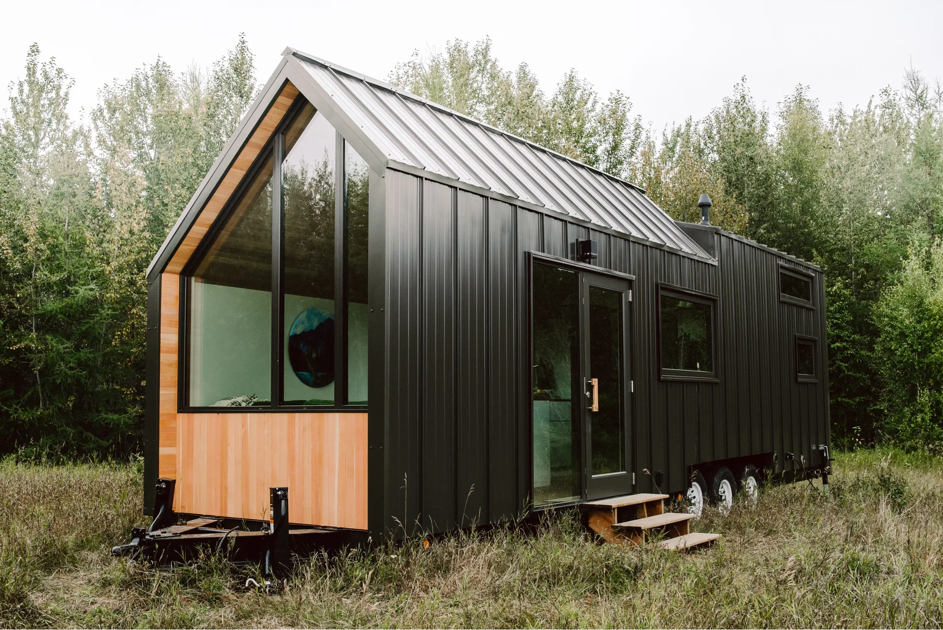 The home’s exterior is covered in countless 16-inch slats of black steel siding (photography courtesy of Anthem Creative)