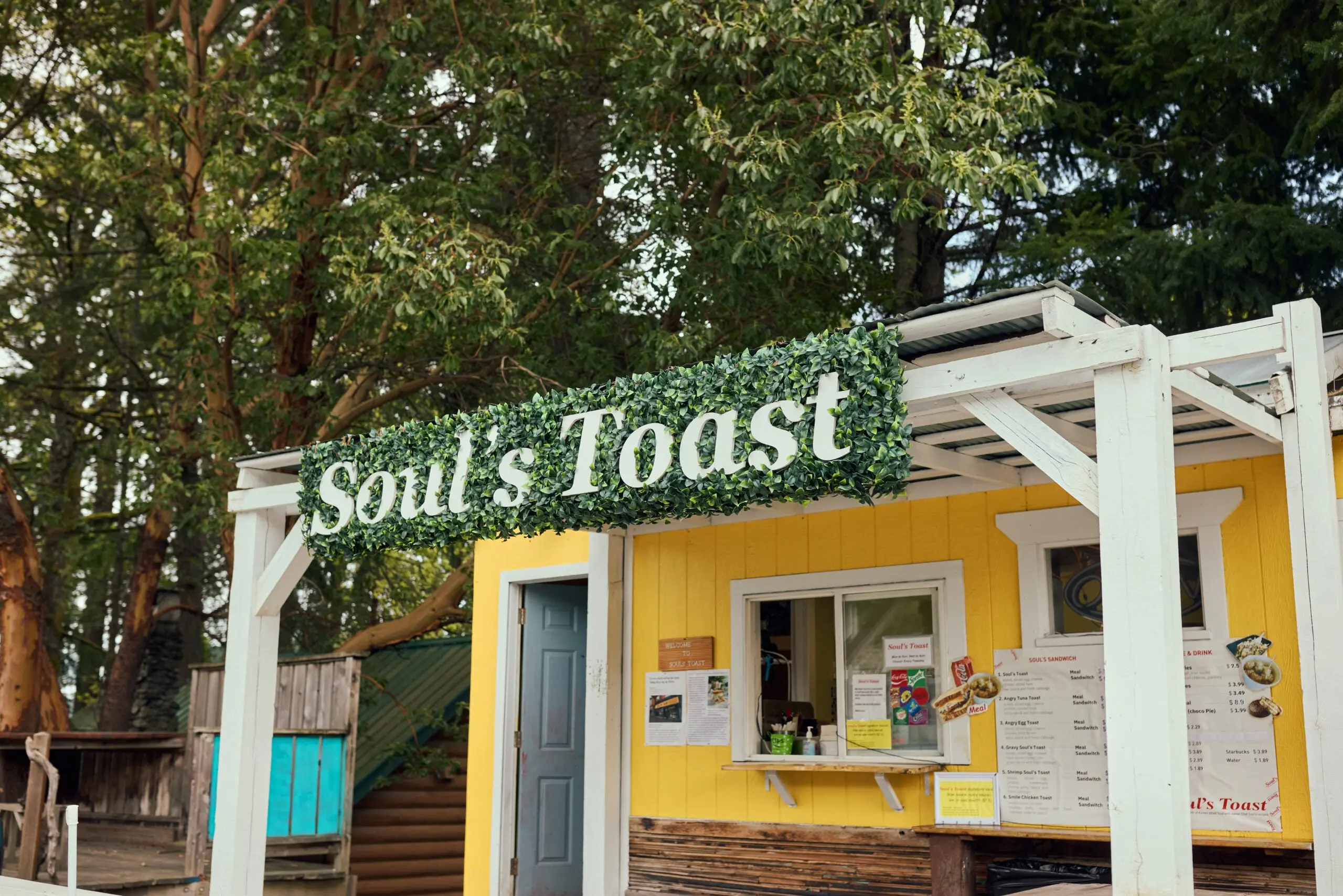 A highway-side food stall with the words "Soul's Toast" in big white letters