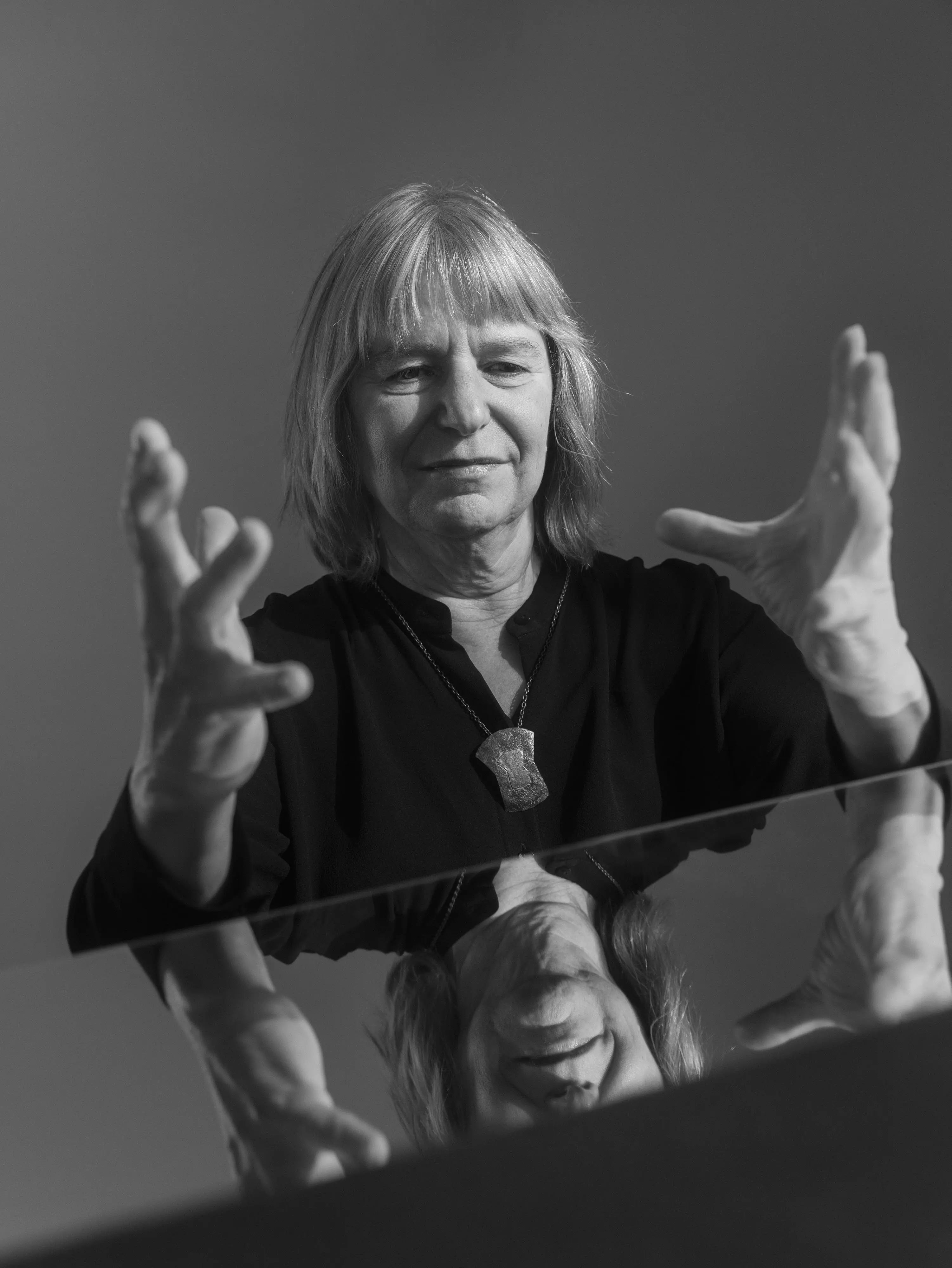 Suzanne Simard is posing for the picture, photographed in black and white.