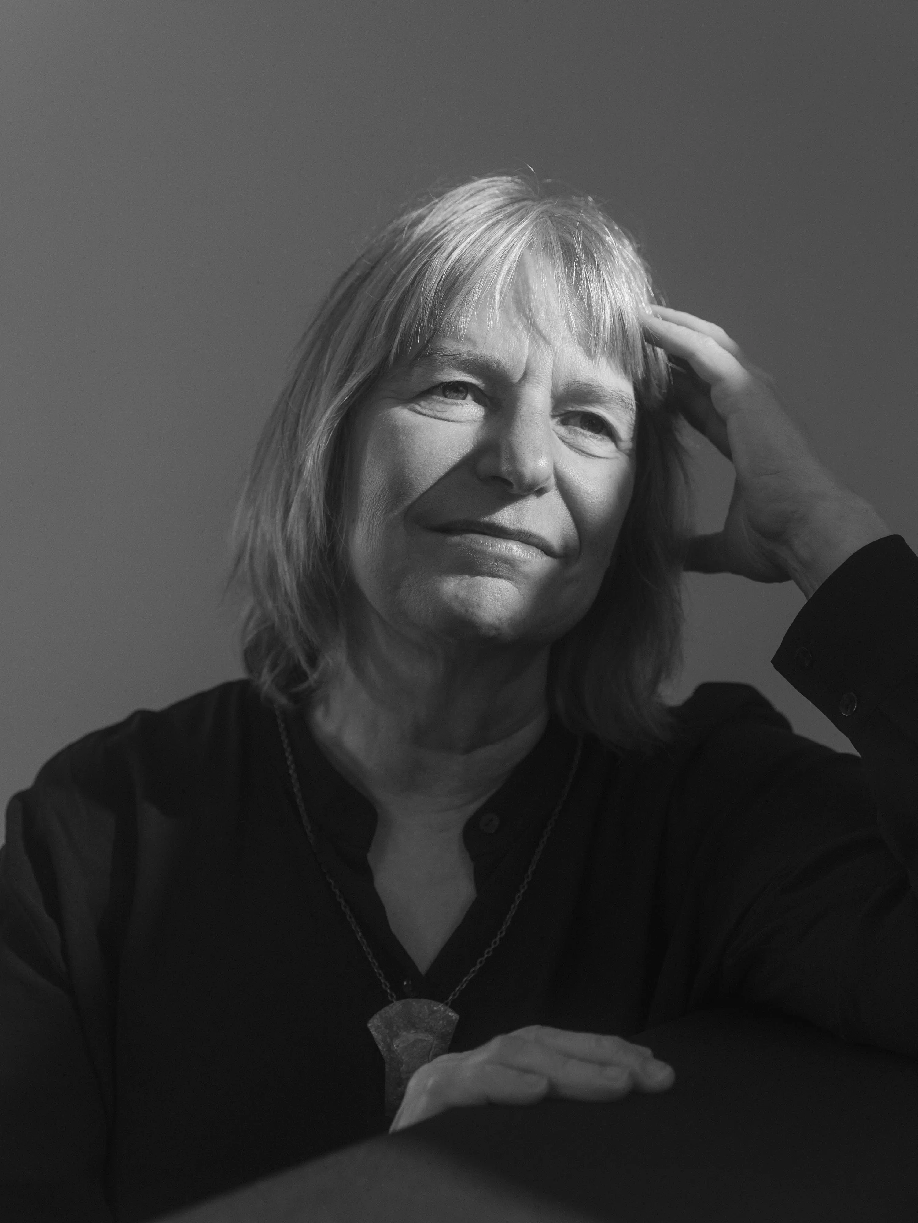 Suzanne Simard is posing for the picture, photographed in black and white