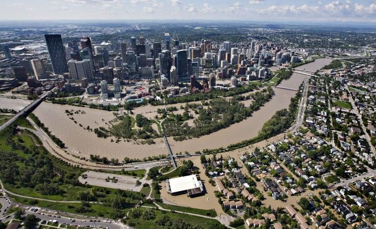 <p>The Bow River over flows its banks into the downtown core and residential areas in Calgary, Alberta June 22, 2013. The heaviest floods in decades shut down the Canadian oil capital of Calgary on Friday, forcing the evacuations of tens of thousands of residents and shutting the Alberta city&#8217;s downtown core. Some 1,300 troops were deployed to help with rescues and the mandatory evacuations that forced 100,000 people from their homes in Calgary and thousands more in the small towns surrounding the city.   REUTERS/Andy Clark </p>
