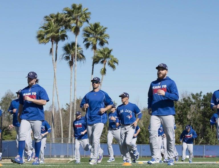 <p>Toronto Blue Jays players including R.A. Dickey (left) and Russell Martin (right) warm up at spring training in Dunedin, Fla. on Sunday February 28, 2016. (Frank Gunn/CP)</p>
