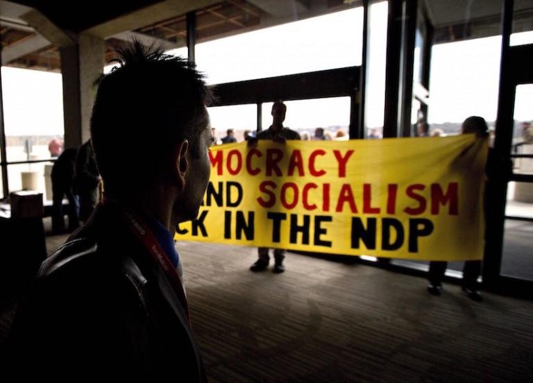 <p>NDP delegates show a banner during the 2016 NDP Federal Convention in Edmonton Alta, on Sunday, April 10, 2016. THE CANADIAN PRESS/Jason Franson</p>
