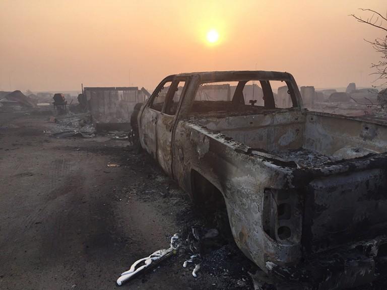 <p>A burned-out truck in the Beacon Hill area of Fort McMurray, Alta. is shown on Wednesday, May 4, 2016. (Sylvain Bascaron/Radio-Canada/CP)</p>
