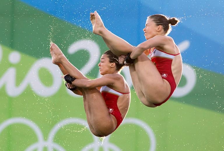 <p>Canada&#8217;s Meaghan Benfeito (left) and Roseline Filion perform a dive on their way to a bronze medal win in women&#8217;s synchronized 10-meter platform diving at the 2016 Summer Olympics in Rio de Janeiro, Brazil, Tuesday, Aug. 9, 2016 (Frank Gunn/CP)</p>

