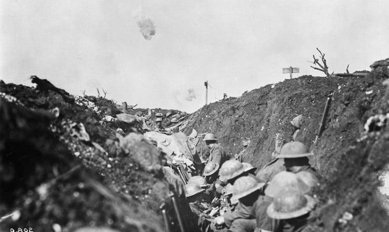 <p>Shrapnel bursts over a reserve trench in Canadian lines during the Battle of the Somme, France in 1916.       W.I. Castle/Library and Archives Canada</p>
