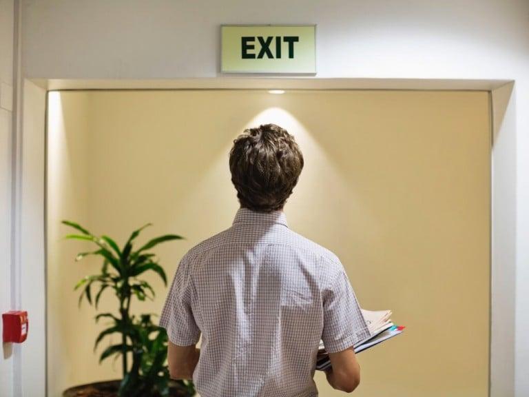 Employee with exit sign
