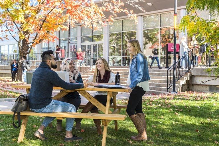 Carleton University students hanging out on campus