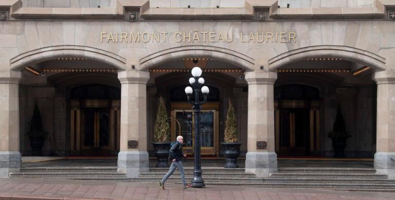 A man jogs past the Chateau Laurier hotel in Ottawa on March 20, 2020 (CP/Adrian Wyld)