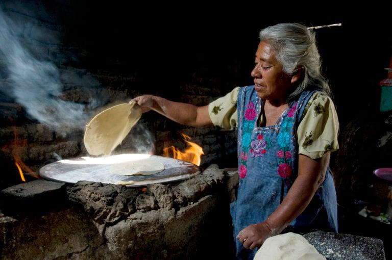 Homemade tortillas made on the comal (griddle) heated by wood. Central Valleys of Oaxaca, Mexico. (Jean-Claude Teyssier)