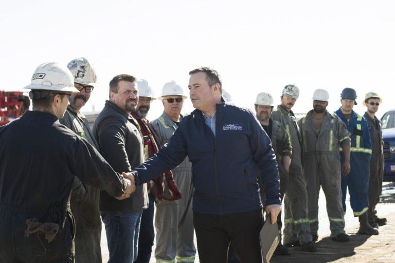 Kenney speaking with oilpatch workers in Leduc Alta. in March. (Amber Bracken/CP)