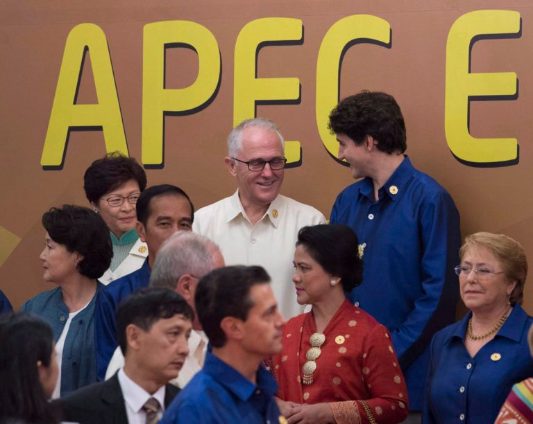 Canadian Prime Minister Justin Trudeau speaks with Australian Prime Minister Malcolm Turnbull as leaders take their place for the APEC Leaders Official Photograph at the APEC Summit in Danang, Vietnam Friday November 10, 2017. (Adrian Wyld/CP)