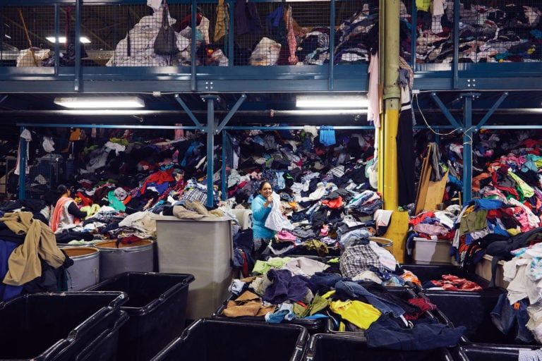 Toronto Textile Recycling buys donated clothing, and employees sort and grade each piece before the clothes are sold around the world (Photograph by Christie Vuong)
