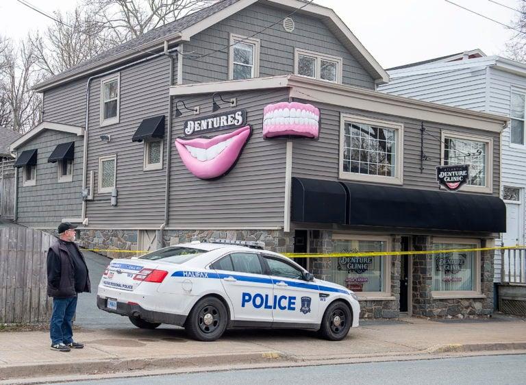 The Atlantic Denture Clinic is guarded by police in Dartmouth, N.S. on Monday, April 20, 2020. The business is owned by alleged killer Gabriel Wortman. Police say 17 people are dead, including RCMP Const. Heidi Stevenson, after a man went on a murder spree in several Nova Scotia communities. Wortman, 51, was shot and killed by police. THE CANADIAN PRESS/Andrew Vaughan