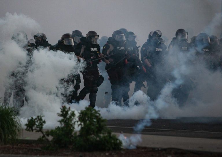 Police in Minneapolis move toward protesters on May 30 (Jason Armond/Los Angeles Times /Getty Images)