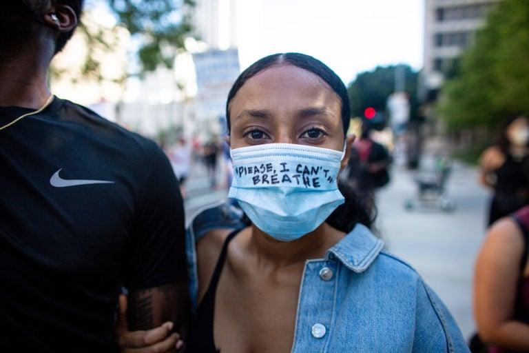 Protests across the U.S. began in May and continued into June: a protester in Los Angeles on May 27 (Jason Armond /Los Angeles Times/Getty Images)