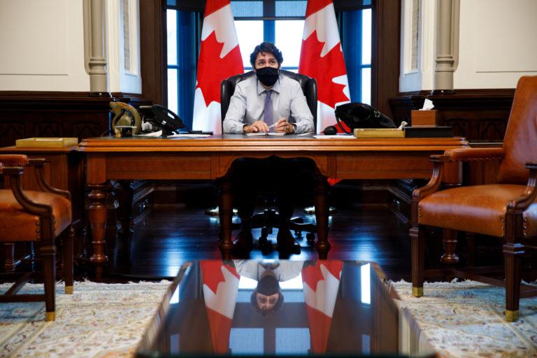 Prime Minister Trudeau is briefed prior to Cabinet in his West Block office. May 15, 2020. (Courtesy of Adam Scotti/PMO)