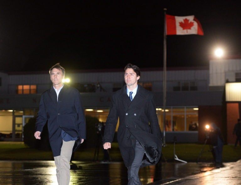 Trudeau and Morneau walk towards their plane as they depart Ottawa Nov. 13, 2015, for the G20 Summit in Turkey (CP/Sean Kilpatrick)