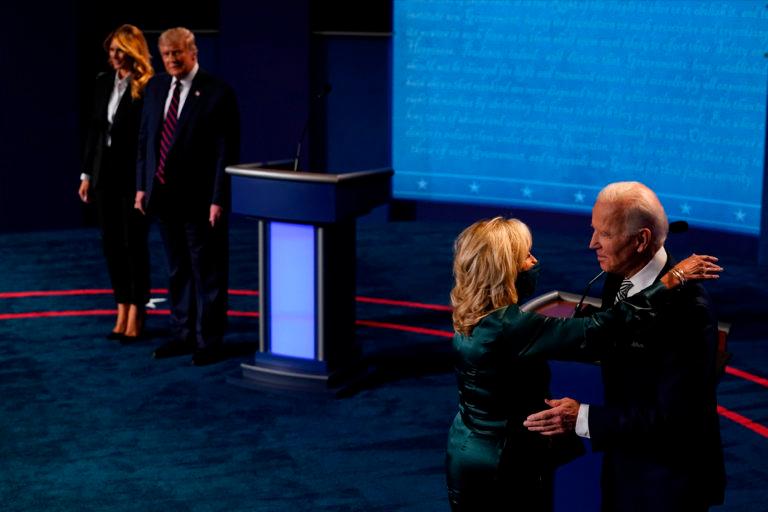 Joe and Jill Biden, right; and Donald and Melania Trump after Tuesday's debate. (Morry Gash/AP Photo/Bloomberg/Getty Images)