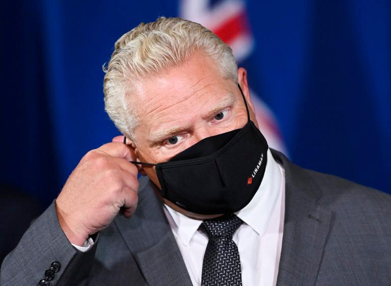 Ontario Premier Doug Ford takes his mask off to answer questions from the media at Queen's Park during the COVID-19 pandemic in Toronto on Monday, September 28, 2020. THE CANADIAN PRESS/Nathan Denette