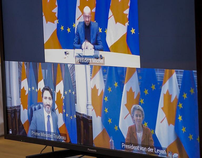 European Council President Charles Michel (Top), European Commission President Ursula Von Der Leyen and Prime Minister of Canada Justin Trudeau are seen on screens at the start of a virtual EU - Canada Summit in Brussels, Belgium, on Oct. 29 (Olivier Hoslet/EPA/CP)