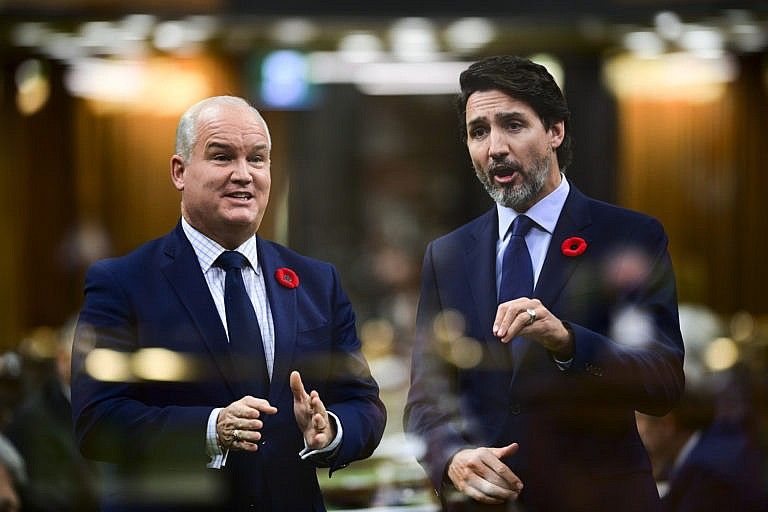 In the multiple-exposed image O'Toole asks a question and Trudeau answers during question period in the House of Commons on Nov. 4, 2020 (CP/Sean Kilpatrick)