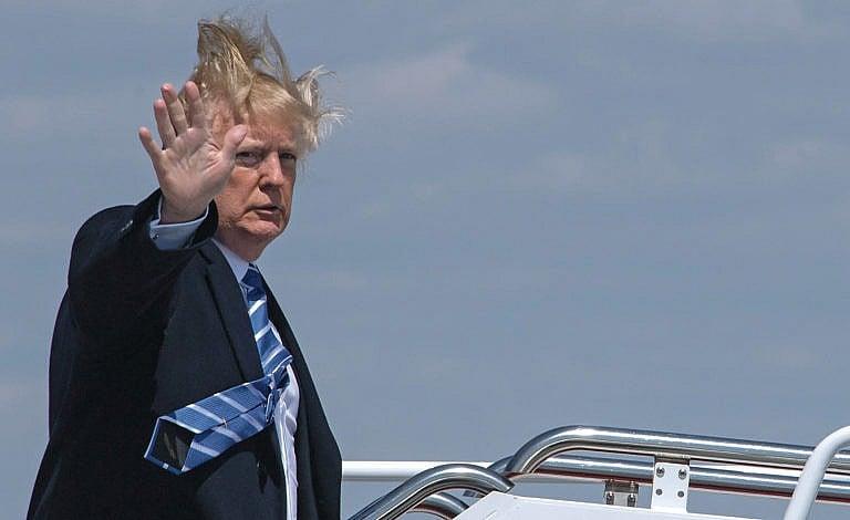 US President Donald Trump boards Air Force One on a windy day at Andrews Air Force base on April 5, 2018 near Washington, DC. - Trump is heading to White Sulphur Springs, West Virginia for a round table discussion on tax reform. (Nicholas Kamm/AFP/ Getty Images)