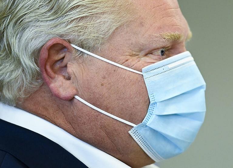 Ontario Premier Doug Ford speaks with frontline health workers at Humber River Hospital ahead of the Ontario budget during the COVID-19 pandemic in Toronto on Thursday, November 5, 2020. THE CANADIAN PRESS/Nathan Denette