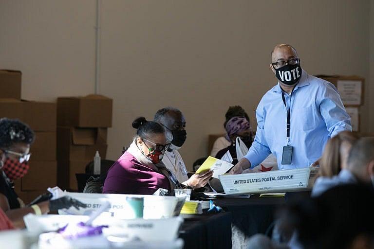 Election workers count Fulton County ballots at State Farm Arena on Nov. 4, 2020 in Atlanta, Georgia (Jessica McGowan/Getty Images)