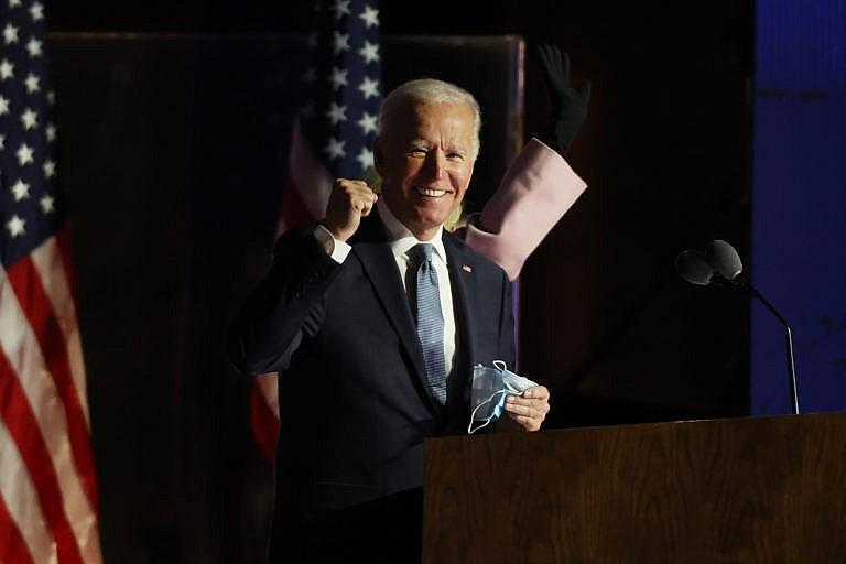 Democratic presidential nominee Joe Biden speaks at a drive-in election night event at the Chase Center in the early morning hours of November 04, 2020 in Wilmington, Delaware. Biden spoke shortly after midnight with the presidential race against Donald Trump still too close to call. (Tasos Katopodis/Getty Images)