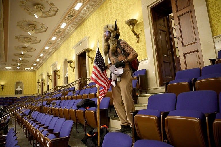 A Trump supporter yells inside the Senate Chamber on Jan. 06, 2021 in Washington, DC (Win McNamee/Getty Images)