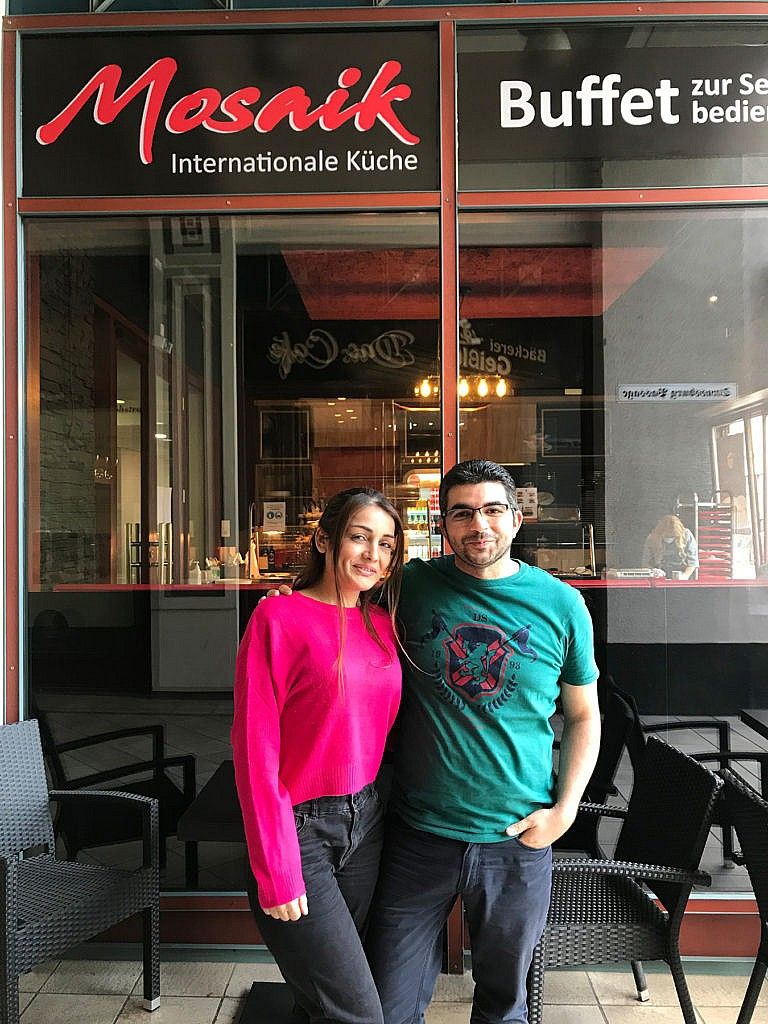 Shmayess (right) left Syria for Görlitz, Germany, in 2015; his wife, Ammar, joined him a year later and the couple recently opened a restaurant (Photograph by Sadiya Ansari)